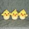 3 crocheted chicks popping out of their eggs