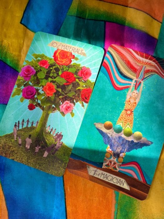 Image of a card with a flowering tree and a card with a magician illustration. Blue, yellow, red, green.