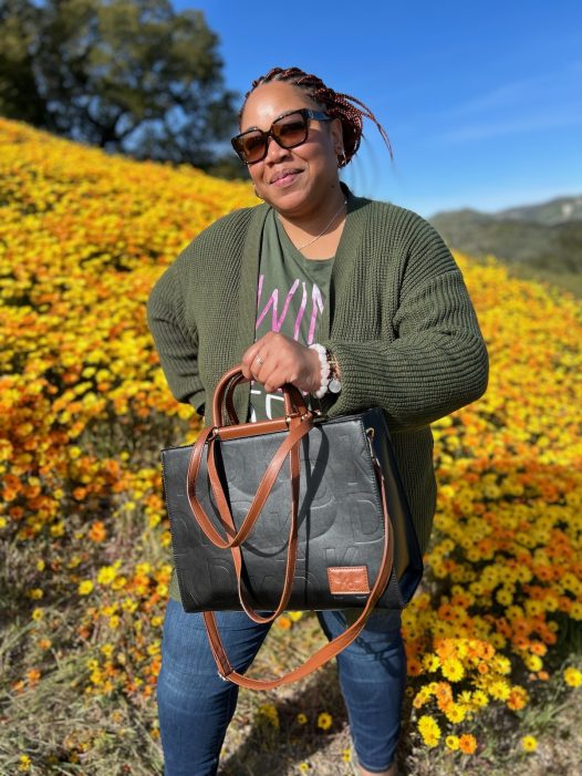 Women holding the Becca Tote